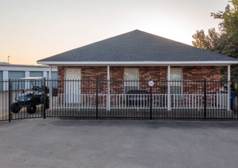 Gated brick office building at Security Self Storage and Parking near Oak Leaf, TX, with secure long-term vehicle storage options